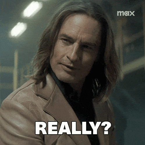 a man with long hair has the word really on his chest