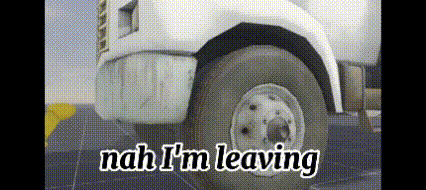 a white truck is driving down a road with the words `` nah i 'm leaving '' written on the side .