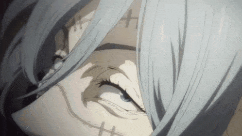 a close up of a person 's face with white hair and a cross tattoo on their forehead .