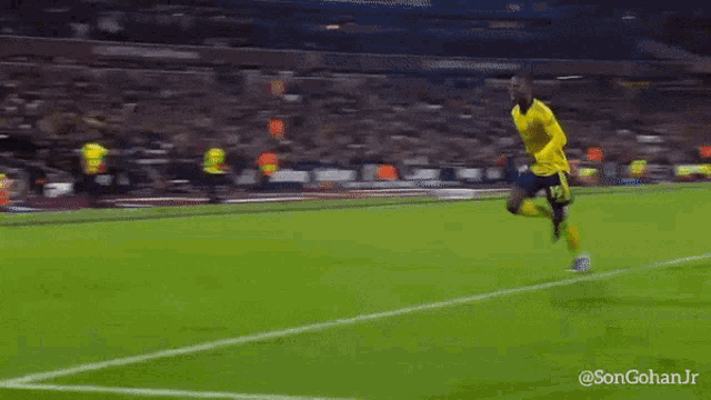 a soccer player is kneeling on the field with the hashtag songohanjr on the bottom