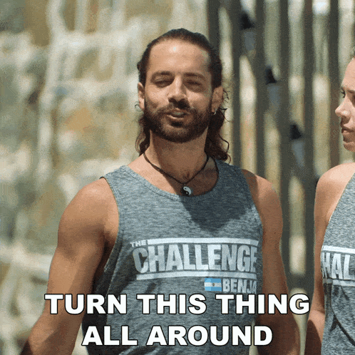 a man with a beard wearing a challenge tank top