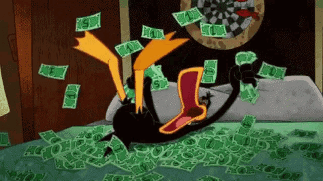a cartoon character is laying on a pile of money on a table .