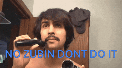 a shirtless man shaves his mustache in front of a mirror with the words " no zubin dont do it "