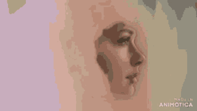 a woman is painting a portrait of a woman 's face with a brush .