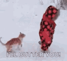 a child is walking in the snow next to a cat and saying `` i 'll butter you '' .