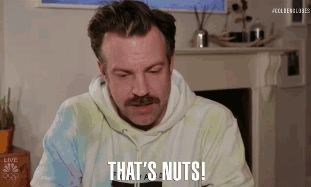 a man wearing a tie dye sweatshirt says that 's nuts