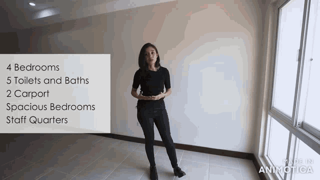 a woman stands in an empty room with a sign that says 4 bedrooms
