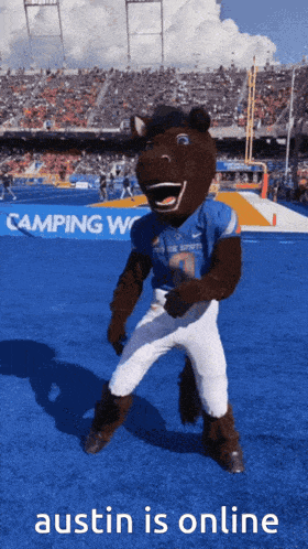a mascot for the blue devils is dancing on a blue field