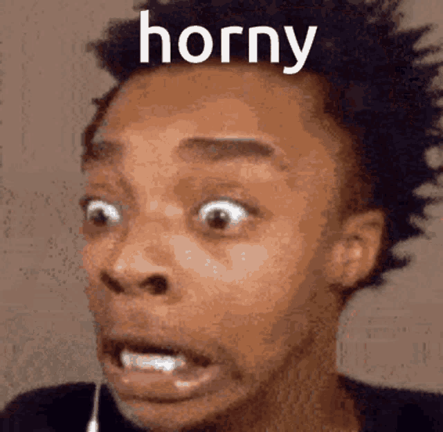 a close up of a man 's face with the word horny written on it .