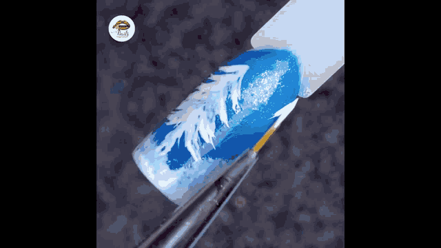a close up of a nail with a snowflake design