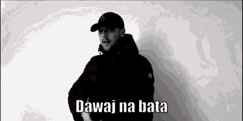 a man wearing a baseball cap is standing in front of a white wall and says dawai na bata .