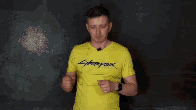a man in a yellow cyberpunk t-shirt holds a knife