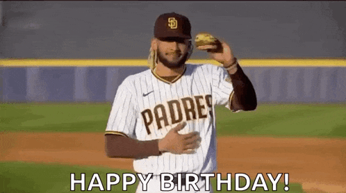 a baseball player is holding a hamburger in his hand and saying `` happy birthday ! ''