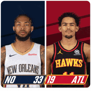 a new orleans basketball player and a hawks basketball player standing next to each other