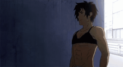 a man without a shirt is standing in front of a wall .