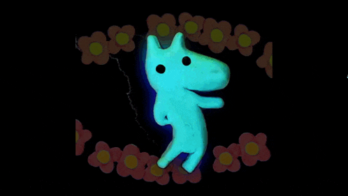a glow in the dark toy with flowers around it