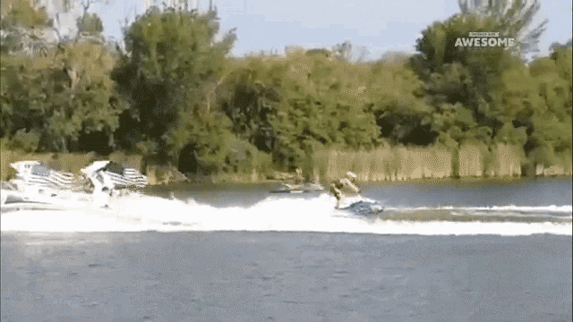 a man is riding a jet ski on a lake and the words awesome are on the bottom of the screen