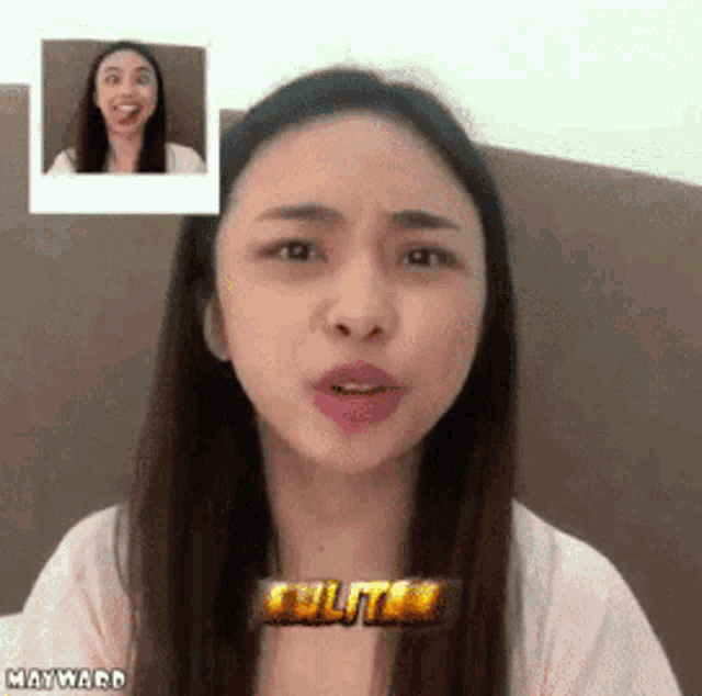 a woman is making a funny face while sitting on a bed with a picture of her behind her .