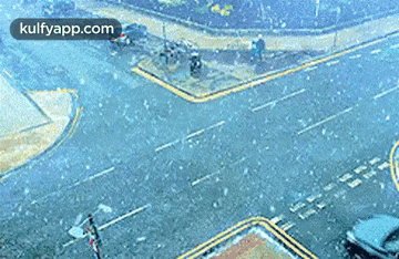 an aerial view of a snowy intersection with the website kulfyapp.com visible