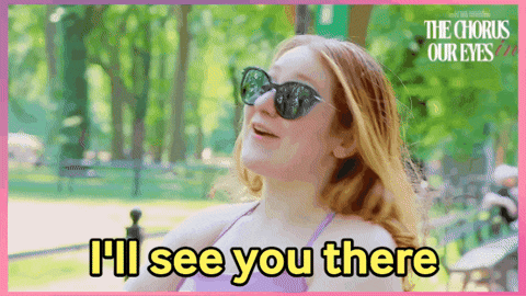 a woman wearing sunglasses says " i 'll see you there " in a park