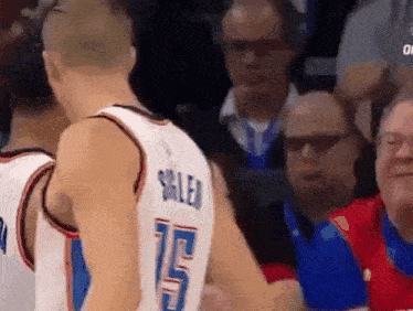 a basketball player wearing a number 15 jersey