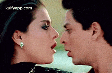 a man and a woman are kissing each other in a movie .