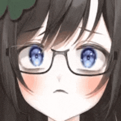 a close up of a girl with glasses and blue eyes making a funny face .
