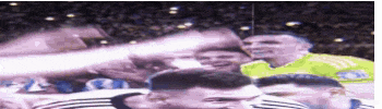 a group of soccer players are standing in a stadium
