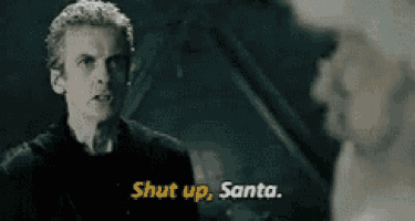 a man is standing next to another man and says shut up santa .