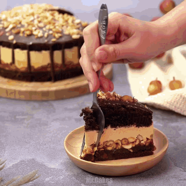 a person is cutting a piece of cake with a fork on a wooden plate