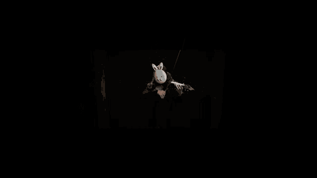 a woman wearing a white bunny mask plays a violin