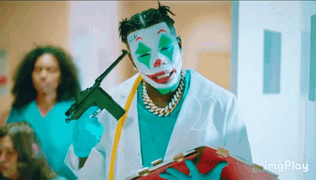 a man in a clown mask is holding a gun and a clipboard ..