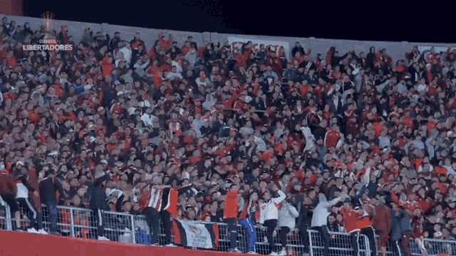 a large crowd of people in a stadium with the words libertadores on the bottom