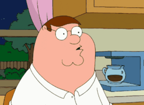 a cartoon character named peter griffin is sitting in front of a coffee maker