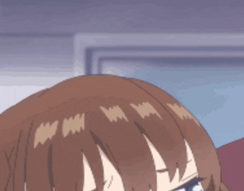 a close up of a girl with brown hair and green eyes