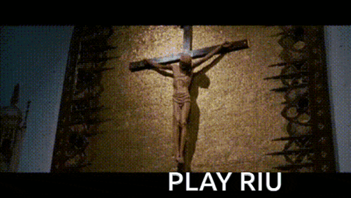 a statue of jesus on a cross with the words play riu below him