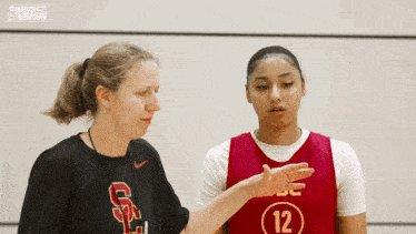 a female basketball player wearing a jersey with the number 12