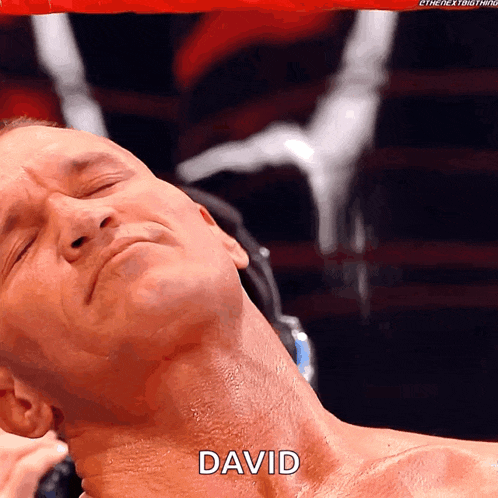 a close up of a man 's neck with the word david written on it