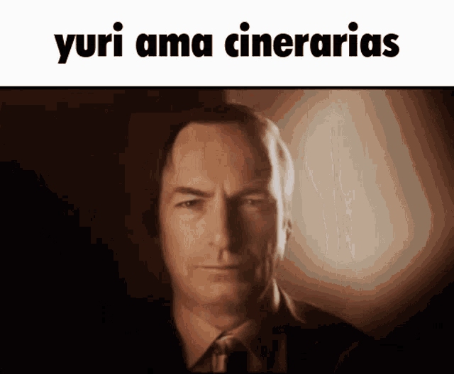 a man in a suit and tie is looking at the camera with a caption that says yuri ama cinerarias