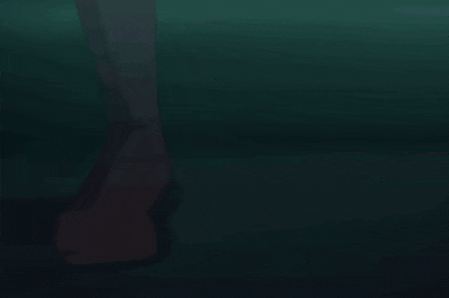 a person holding a knife with a bloody blade
