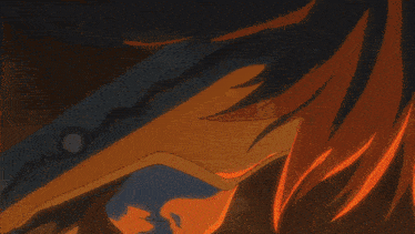 a close up of a blade of a sword with a flame coming out of it