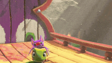 a lizard with a purple spider on its head