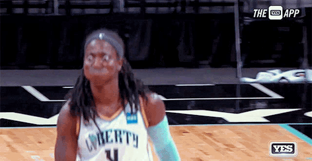 a basketball player wearing a jersey that says " liberty " on it