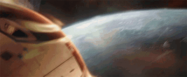 a close up of a space ship flying over the earth .