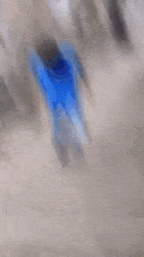 a man is walking up a set of stairs .