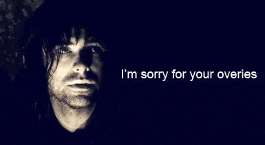a black and white photo of a man with a beard and the words `` i 'm sorry for your overries '' .