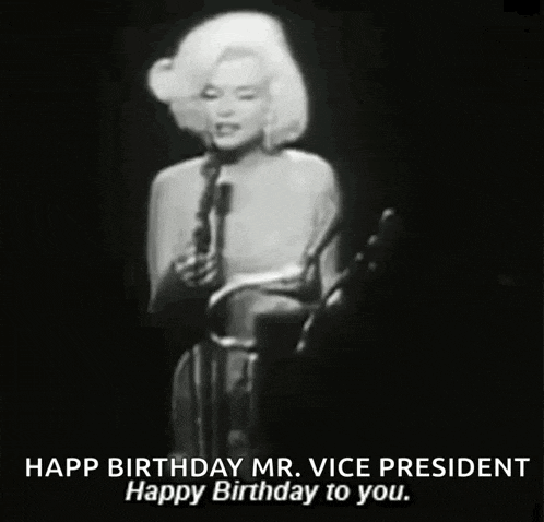a black and white photo of a woman singing into a microphone with the caption happy birthday mr. vice president