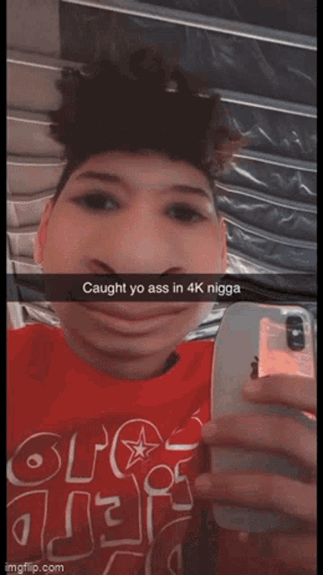a young man taking a selfie with a caption that says caught yo ass in 4k nigga