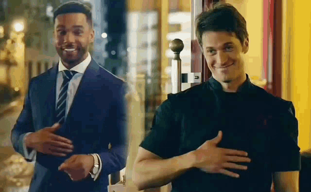 two men in suits and ties are standing next to each other and smiling .