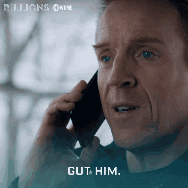 a man talking on a cell phone with the words billions showtime below him